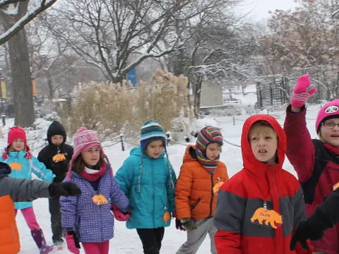a group of children in the snow