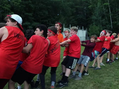 a group of people in red shirts