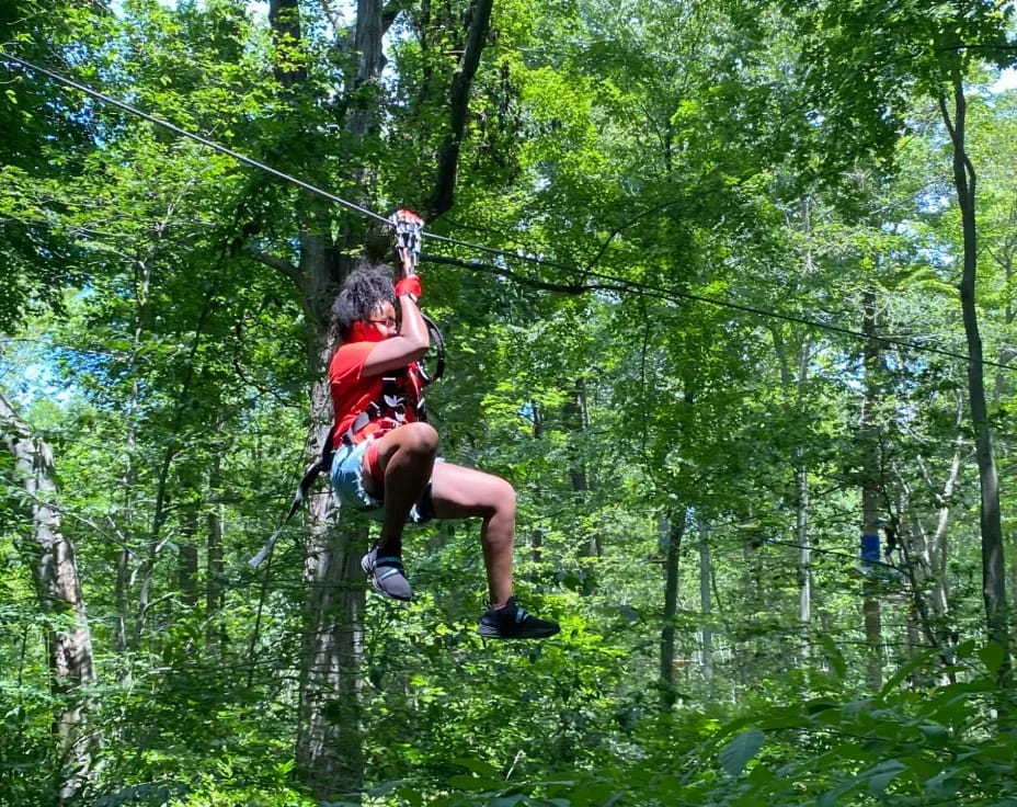 a man on a zip line