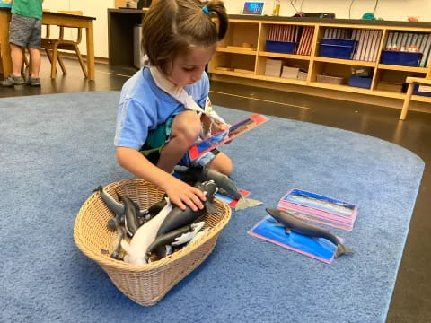 a young girl playing with a toy