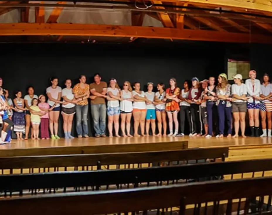 a group of people standing in a room