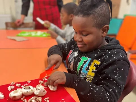 a young boy eating food