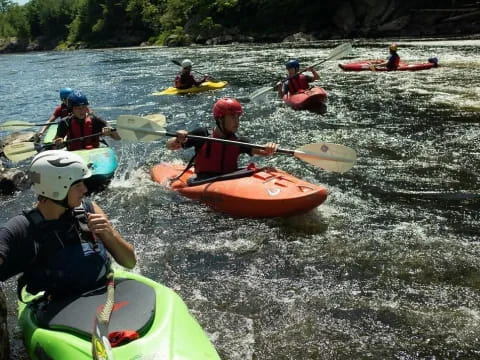 a group of people in kayaks