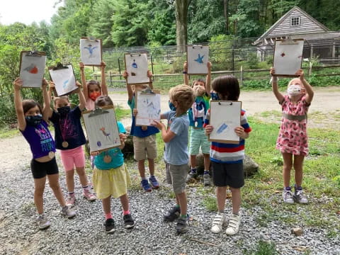 a group of children holding signs