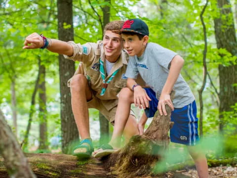 a man and a boy in the woods