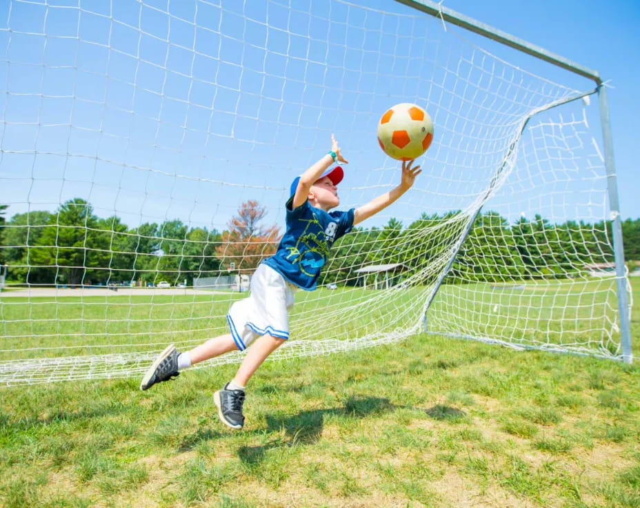 a man jumping to catch a ball
