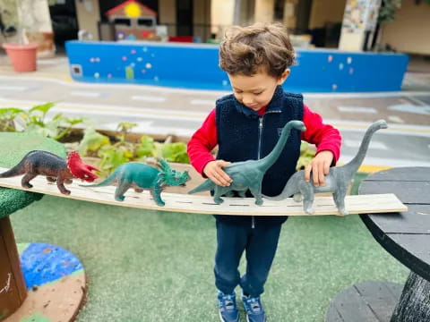 a child holding a snake