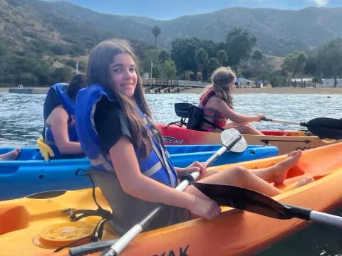 a group of people in a canoe