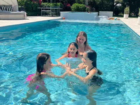 a group of women in a pool