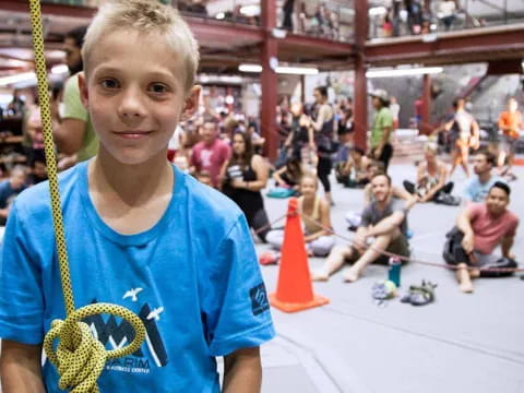 a boy holding a rope