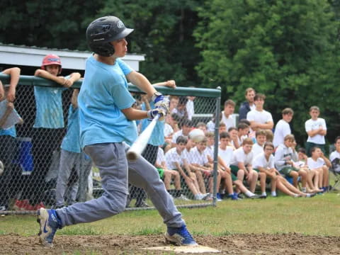 a boy swinging a baseball bat