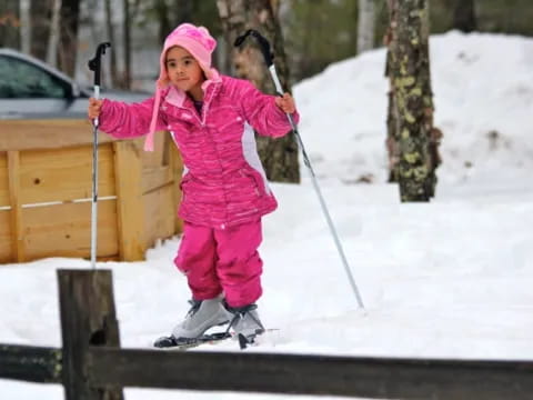 a girl holding skis