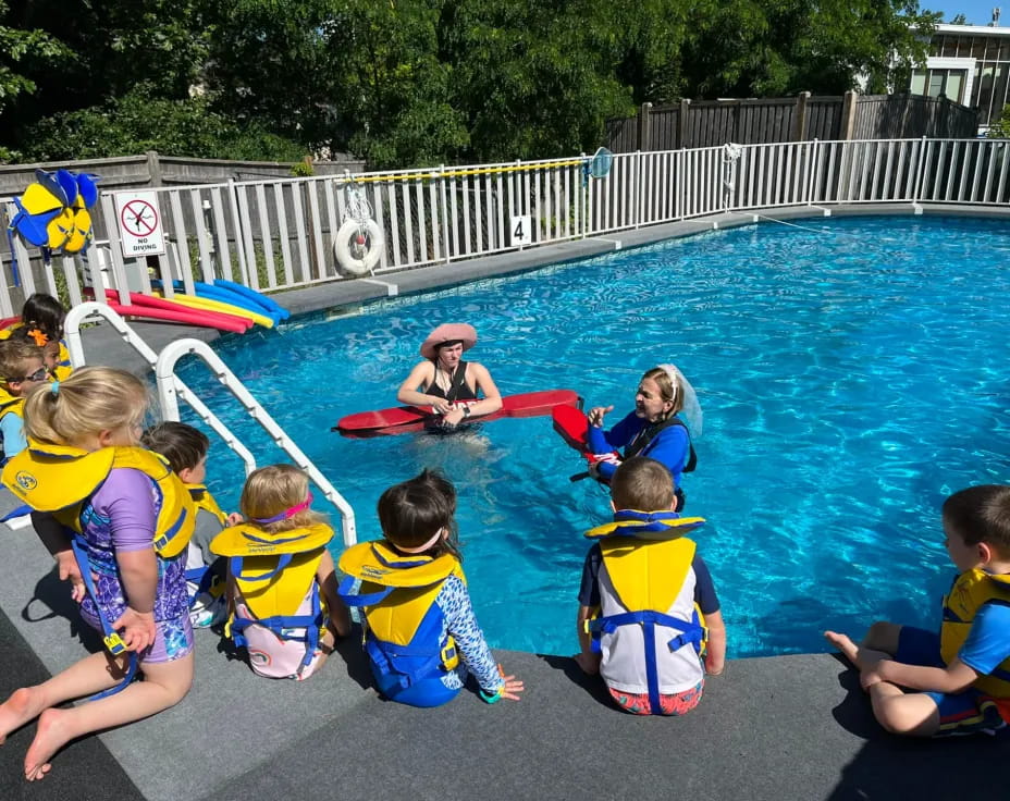 a group of kids in a pool