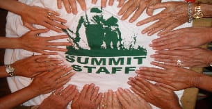a group of hands holding a dollar sign