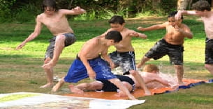 a group of men playing in the sand