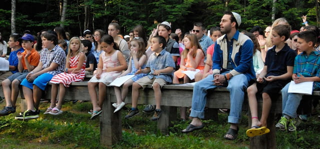 a group of people sitting on a bench
