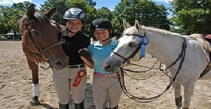a group of people with horses