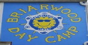a sign with a cartoon face