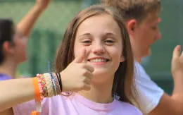 a girl with her hand on her face