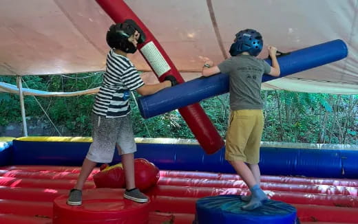 a couple of kids playing on a playground