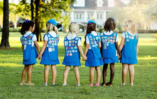 a group of girls in blue uniforms