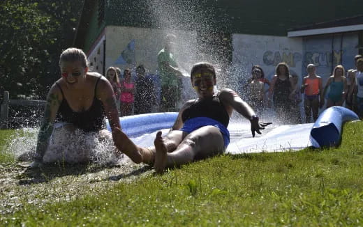 a group of people playing in the mud