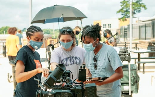 a group of people wearing masks