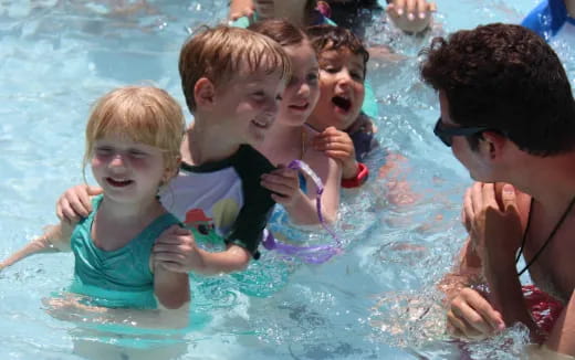 a group of people in a pool