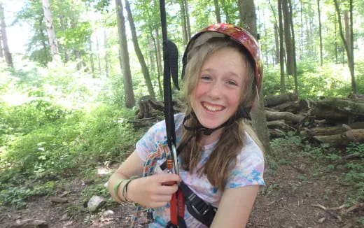 a girl holding a bow and arrow