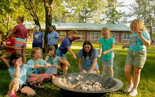 a group of people around a fire