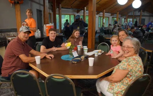 a family sits around a table