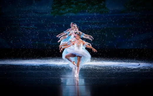 a man and woman dancing on a stage