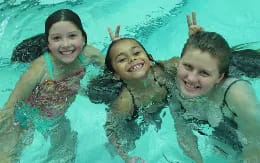 a group of children in the water