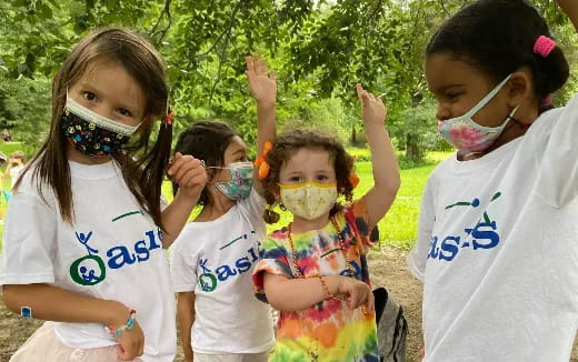 a group of children with face paint