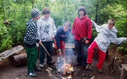 a group of people around a fire