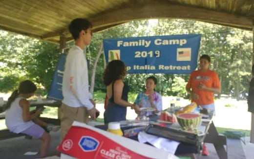a group of people at a food stand