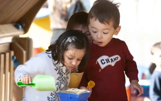 a group of children playing with toys
