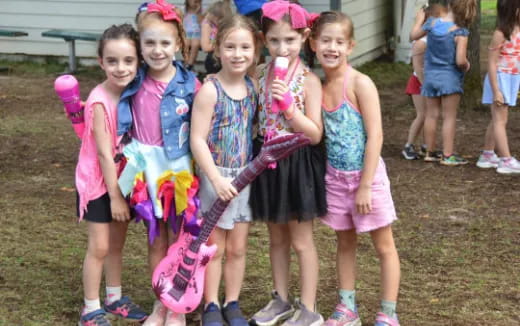 a group of girls posing for a photo