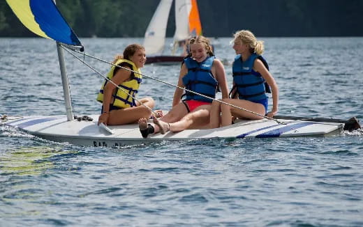 a group of girls in a boat