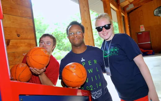 a group of people holding basketballs
