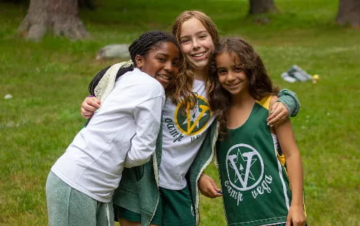 a group of girls in green shirts