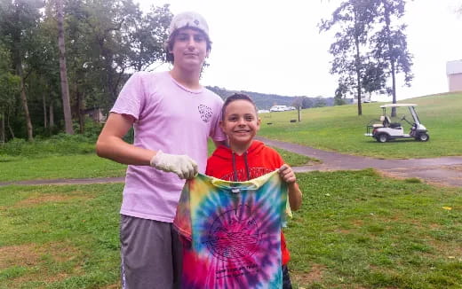 a man and a girl holding a kite