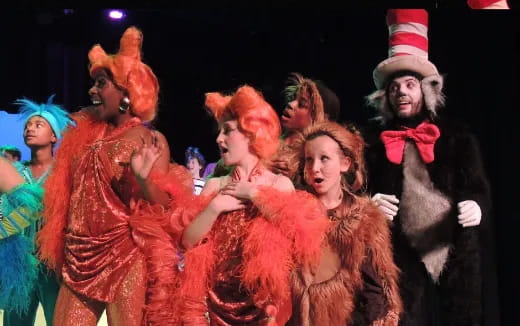 a group of people dressed up in clothing