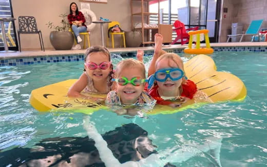 a group of kids in a pool