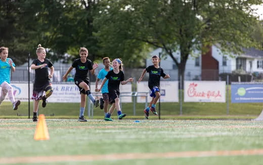 a group of people running on a track