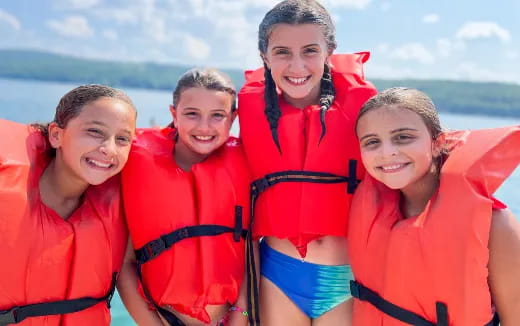 a group of people wearing life jackets