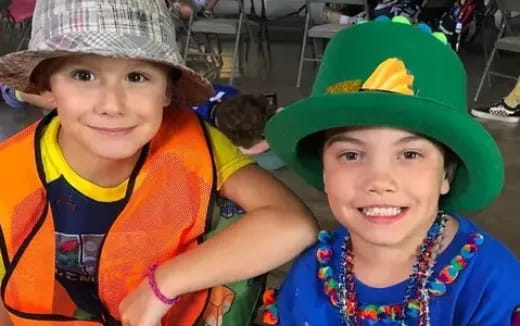 a couple of children wearing hats