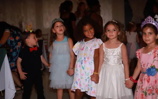 a group of girls in dresses