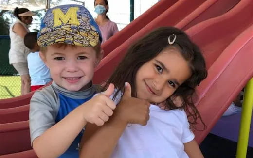 a person and a boy posing for a picture