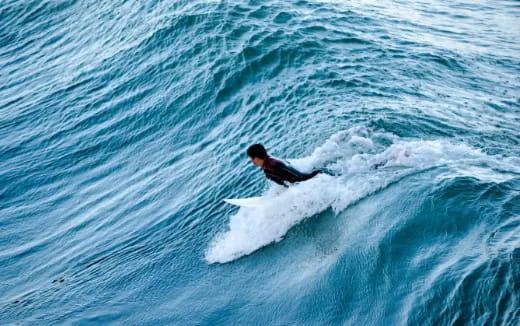 a man surfing on the waves